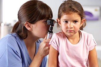 Doctor giving a child an ear exam