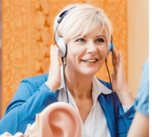 A woman taking a hearing test.